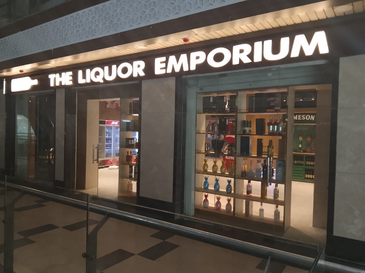 Assorted liquor bottles displayed in premium alcohol store