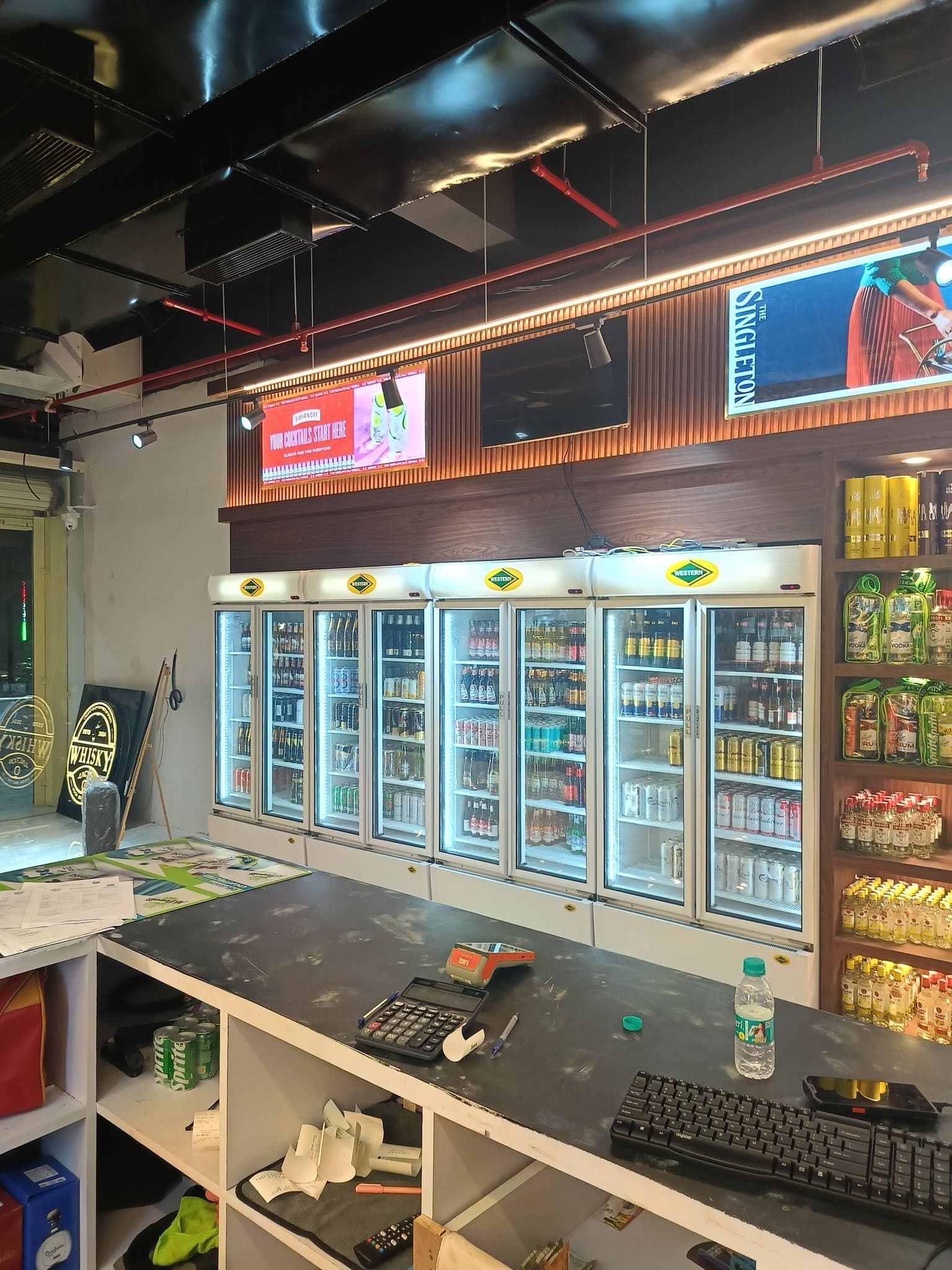 Well-organized liquor display racks at Whisky Junction Noida