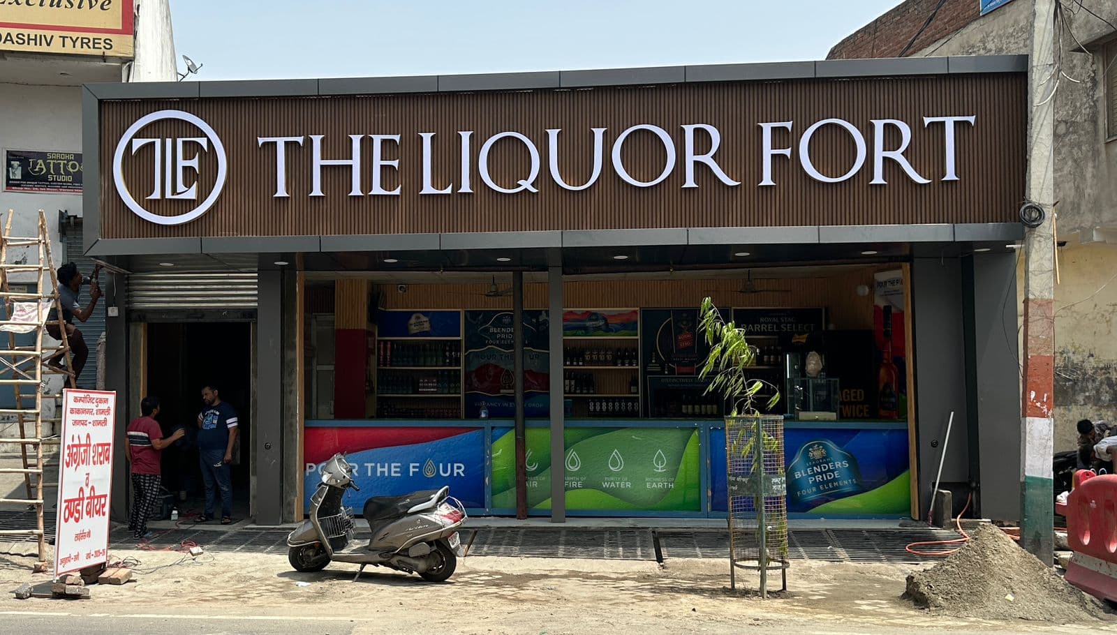 Beer and rum bottles displayed at local daaru store in Uttar Pradesh