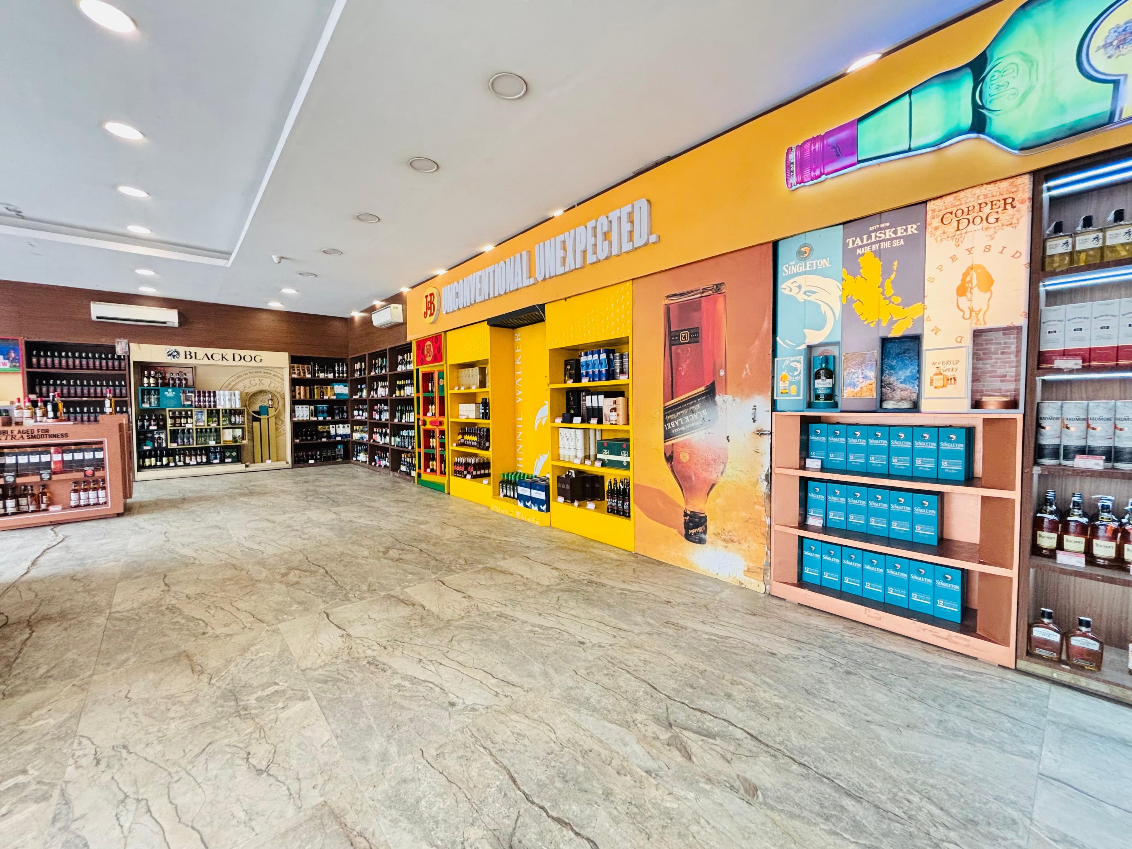 Interior of G-Town Wines Sector 53 showcasing fine wines and spirits