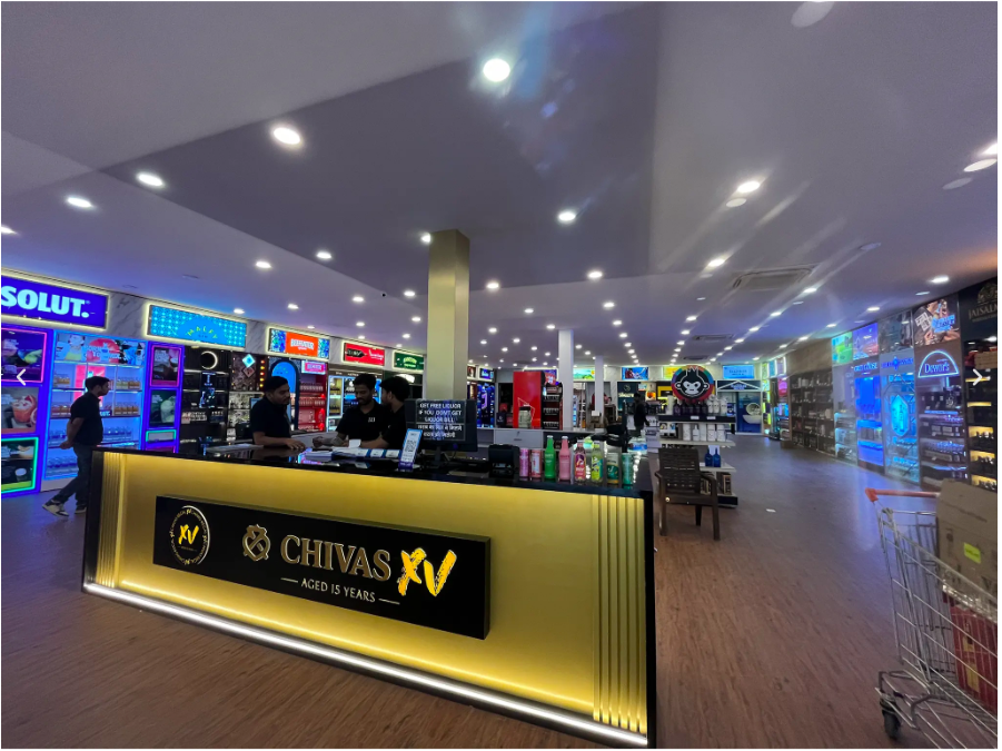 Customer exploring premium wine collection with expert guidance at Daily Dose