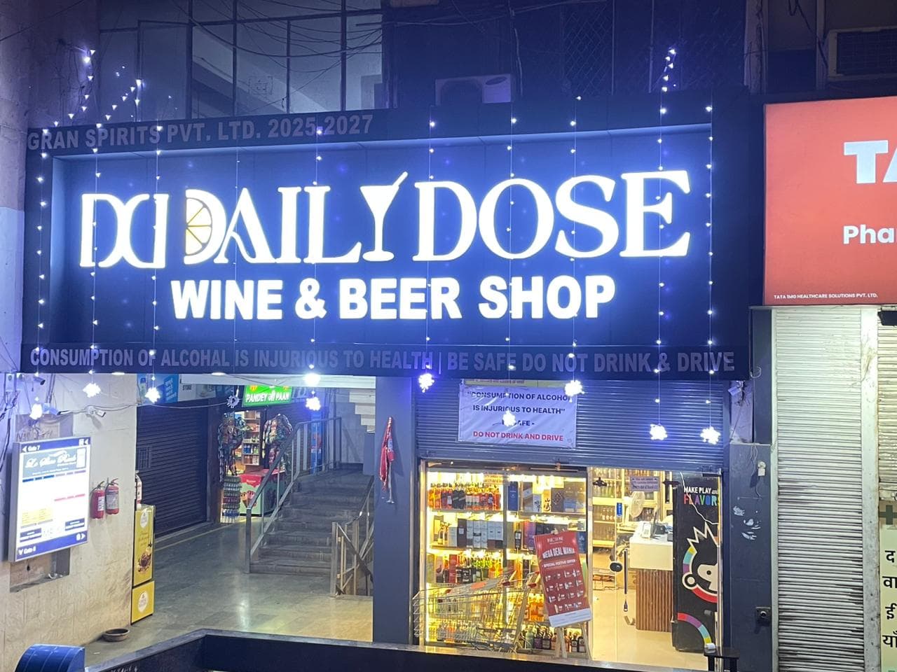 Customer exploring premium wine collection with expert guidance at Daily Dose