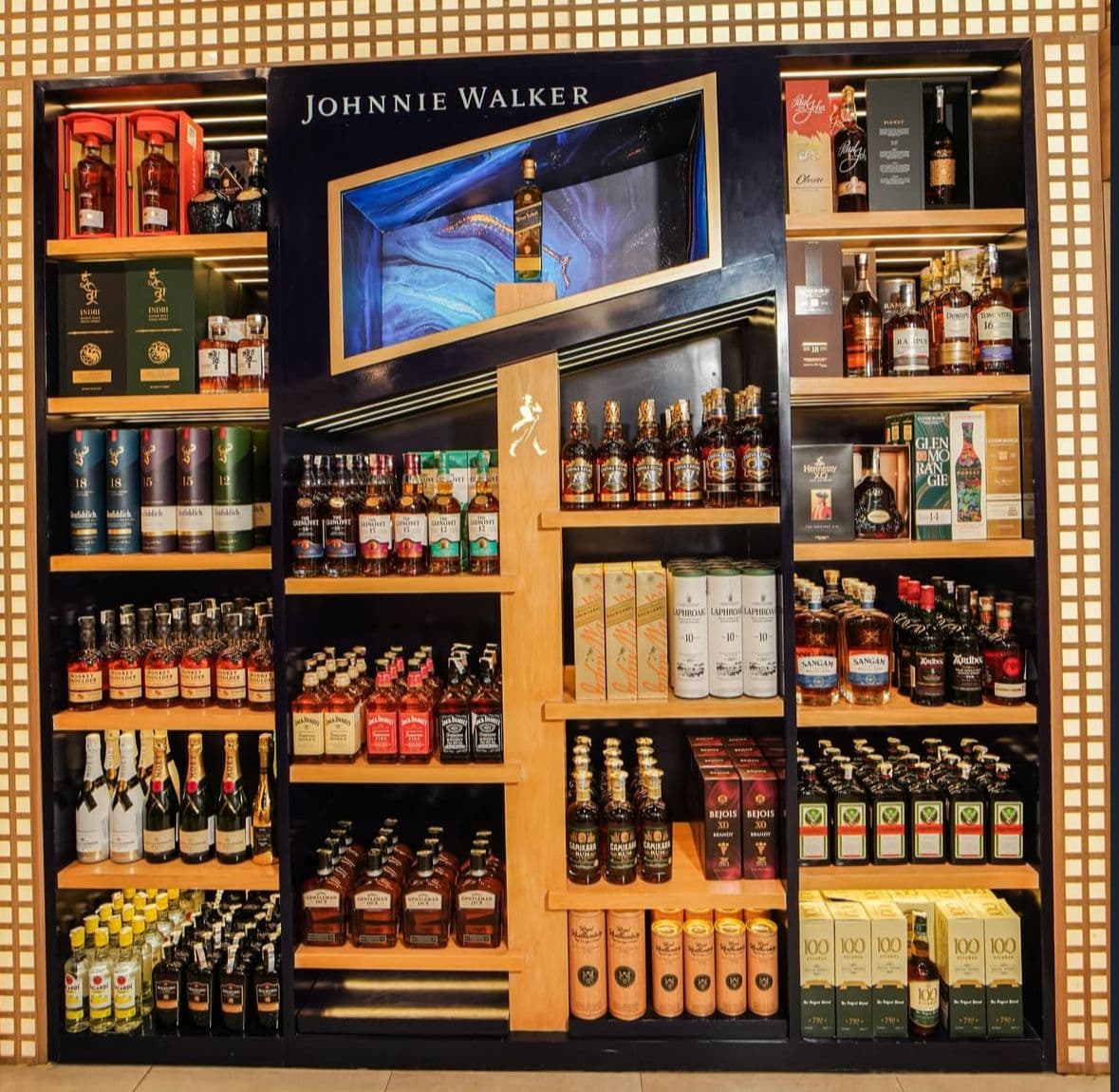 Wine, whisky, gin, and beer displayed in a modern store